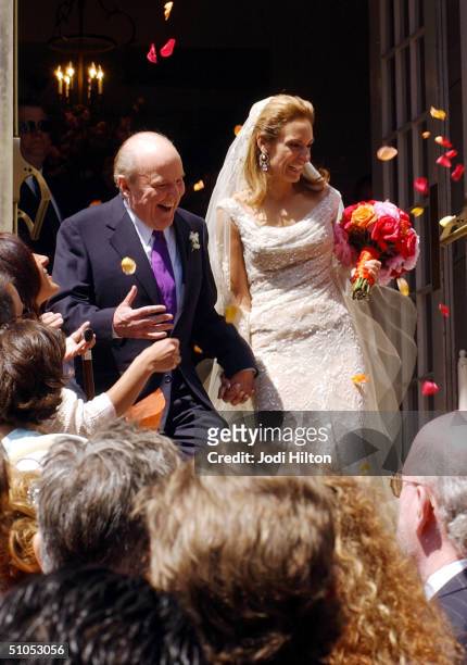 Jack Welch and his new wife Editor Suzy Wetlaufer photographed after their wedding at the Park Street Church in Boston, April 24, 2004.