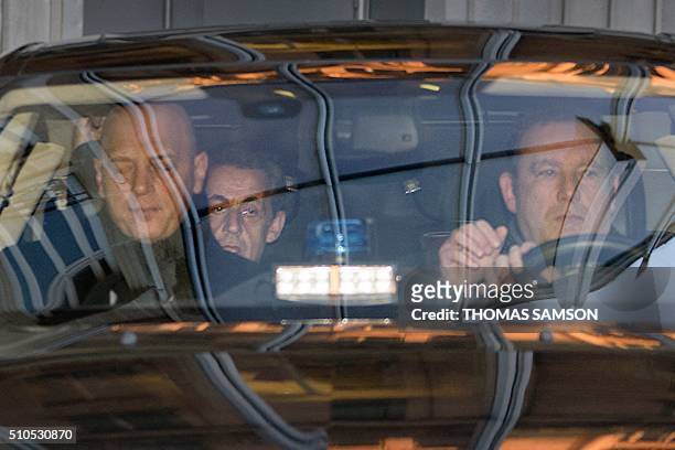Former French President Nicolas Sarkozy arrives at the Pole financier in the French capital, on February 16 to be heard in the investigation of false...