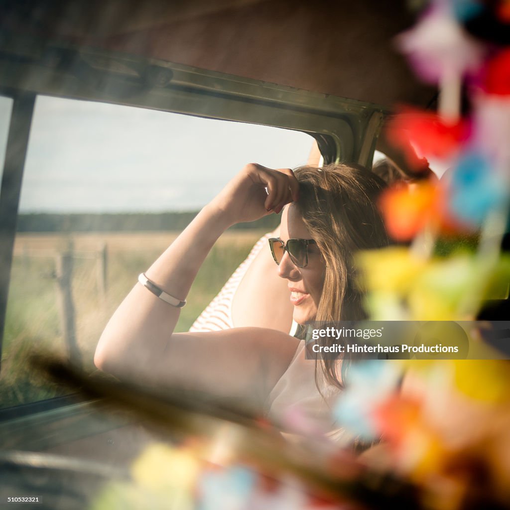 Young Woman Realxing In Camper