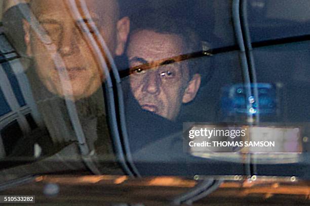 Former French President Nicolas Sarkozy arrives at the Pole financier in the French capital, on February 16 to be heard in the investigation of false...