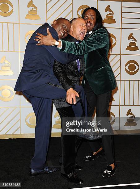 Musicians Philip Bailey, Ralph Johnson and Verdine White of Earth, Wind & Fire pose in the press room at the The 58th GRAMMY Awards at Staples Center...