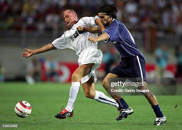 Paul Gascoigne of Internacional holds off Danny of National during the Allstars National v the Allstars Internacional at the Estadio Algarve on July...