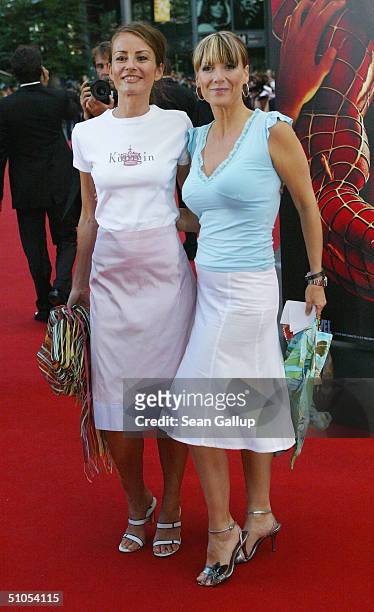German television hostesses Kim Fisher and Sabrina Staubitz attend the German premiere of "Spiderman 2" at the Sony Center on July 6, 2004 in Berlin,...