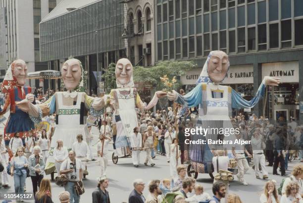 Giant models of peasant women at an anti-nuclear rally in New York City, 12th June 1982.