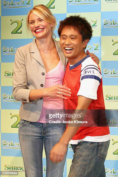 Actress Cameron Diaz and Japanese actor Masatoshi Hamada pose at a photo session during a press conference to promote "Shrek 2" on July 13, 2004 in...