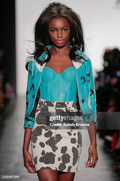 Model walks the runway during the Jeremy Scott fashion show at The Arc, Skylight at Moynihan Station on February 15, 2016 in New York City.