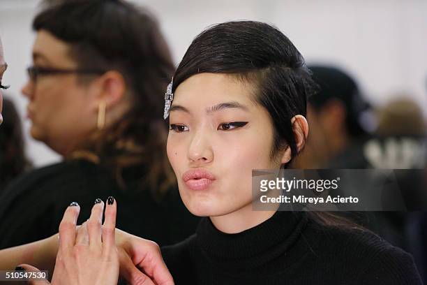 Model prepares backstage at the Maiyet backstage during Fall 2016 New York Fashion Week at Cedar Lake on February 15, 2016 in New York City.