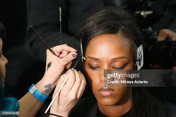 Model prepares backstage at the Maiyet backstage during Fall 2016 New York Fashion Week at Cedar Lake on February 15, 2016 in New York City.