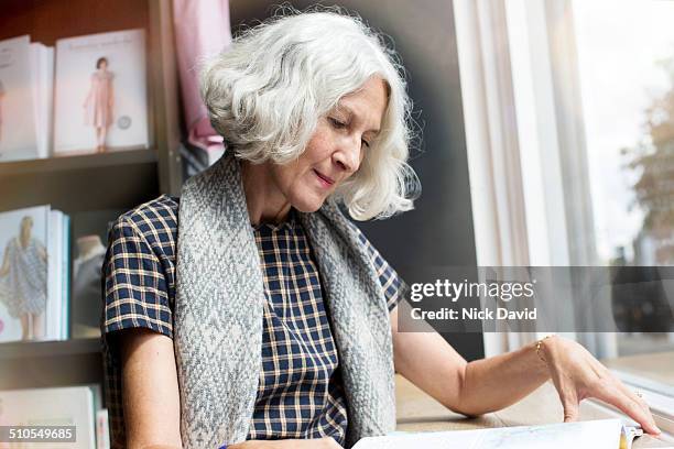 Woman looking through magazine