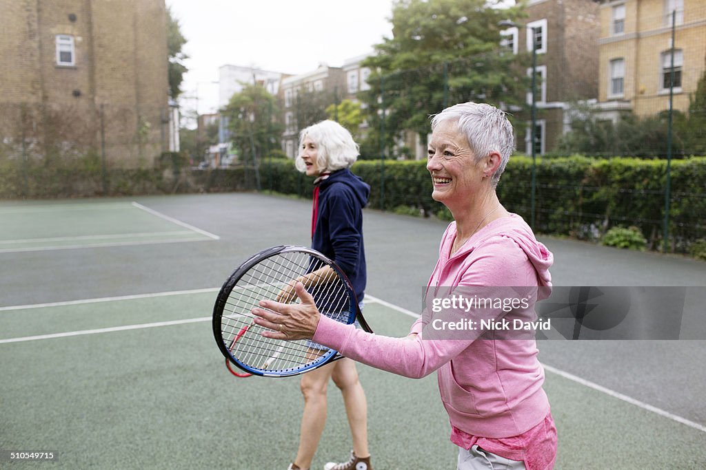 Friends playing tennis