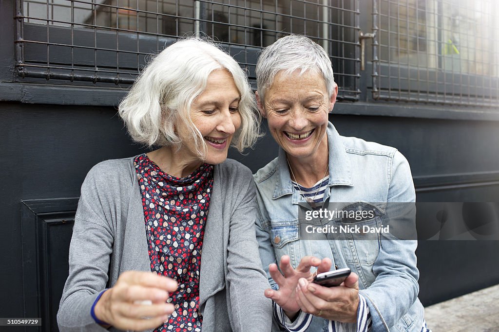 Friends chatting outside a cafe