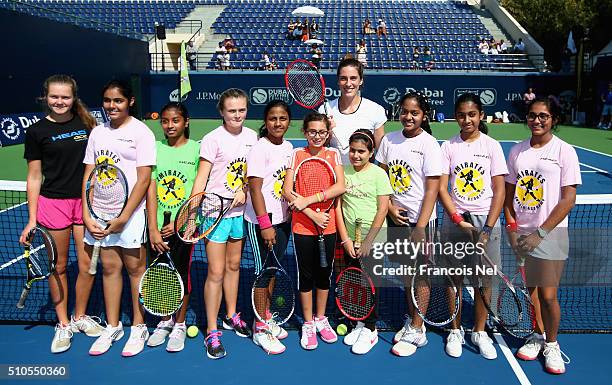 Andrea Petkovic of Germany poses with children after their kids clinic during day two of the WTA Dubai Duty Free Tennis Championship at the Dubai...