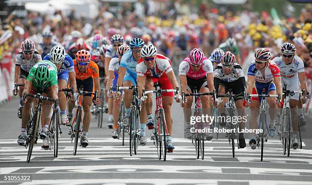 Robbie McEwen of Australia riding for the Lotto Domo team beats at the line Thor Hushov of Norway riding for the Credit Agricole team and wins Stage...