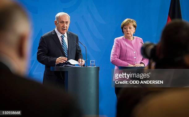German Chancellor Angela Merkel and Israel's prime minister Benjamin Netanyahu speaks at a press conference at the Chancellery in Berlin on February...
