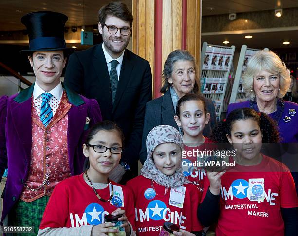 Camilla, Duchess of Cornwall poses with children attending the 'Imagine' festival, actor Jonothan Slinger as 'Willy Wonka', Roald Dahl's grandson...