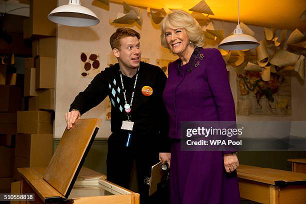 Staff member from Southbank Centre speaks to Camilla, Duchess of Cornwall during a preview of the new 'Wondercrump World of Roald Dahl' exhibition...