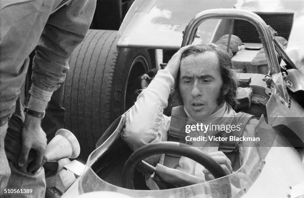 Jackie Stewart sits in his Matra car before the race, Great Britain, Silverstone, 1969.