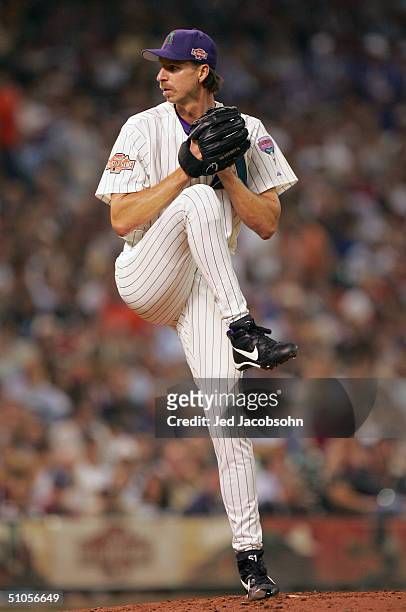 Randy Johnson of the National Team throws a pitch during the third inning of the Major League Baseball 75th All-Star Game at Minute Maid Park on July...