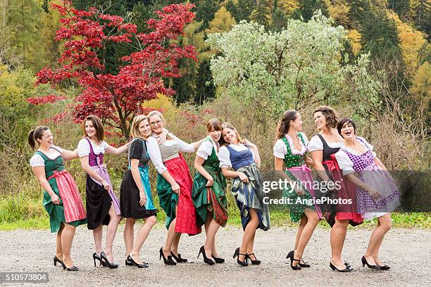 girl power in dirndl - dirndl stock pictures, royalty-free photos & images