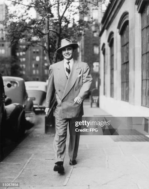 Gentleman in a zoot suit strides through New York's Tudor City, circa 1948.