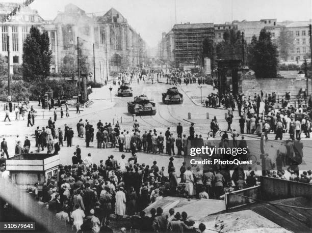 Red Army tanks move up the Leipzigerstrasse toward the Potsdamerplatz to stop the rioting, after the Communist 'People's Police' had failed to...