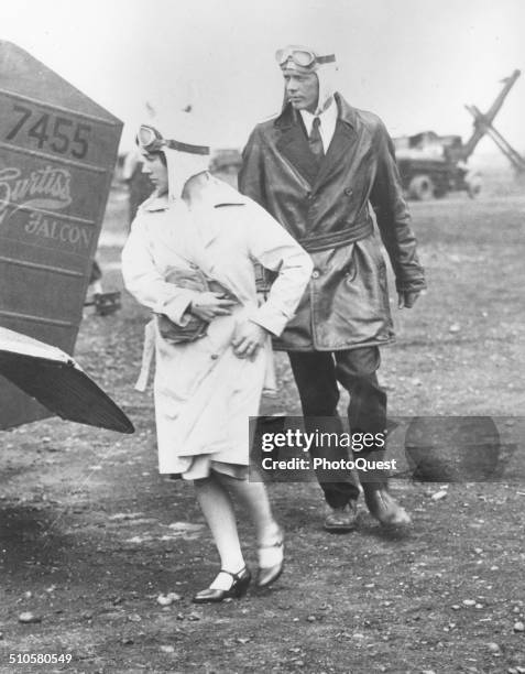 Here Charles A Lindbergh and Mrs Anne Morrow Lindbergh prepare to take off from Roosevelt Field, LI for an inspection flight tour, New York, 1929....