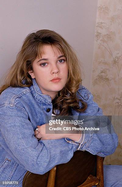 Publicity photo for the CBS Schoolbreak Special '15 and Getting Straight ,' shows American actress Drew Barrymore sitting backwards on a chair, 1989....