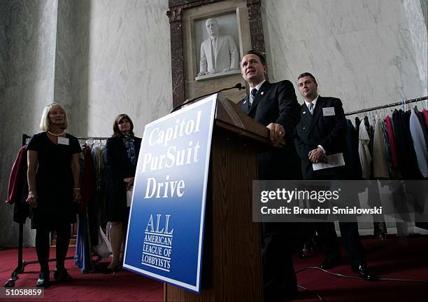 Congressman Wally Herger , Chairman of the Ways and Means Subcommittee on Human Resources, speaks during a clothes drive in the foyer of the Rayburn...