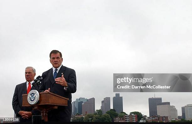 Secretary of Homeland Security Tom Ridge speaks to reporters July 14, 2004 across the harbor from the Fleet Center at the Charlestown Navy Yard in...