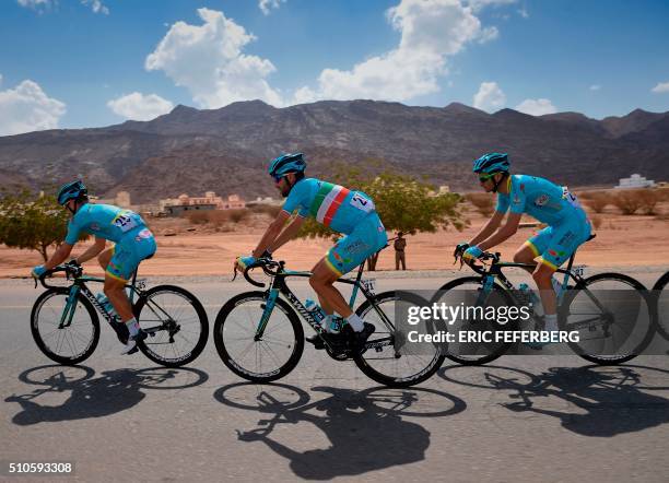 Italian Vincenzo Nibali rides with Astana teammates Italian Andrea Guardini and Italian Michele Scarponi during the first stage of the 7th cycling...