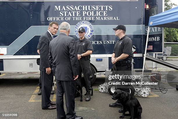 Homeland Security Secretary Tom Ridge and Boston Mayor Thomas Menino, speak to Massachusetts State Police Bomb Squad officers, who handle K-9 dogs,...