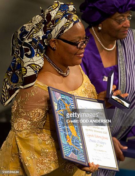 Nobel Peace Prize laureate, Liberian activist Leymah Gbowee, poses with her medal and certificate on December 10, 2011 during the Nobel Peace Prize...