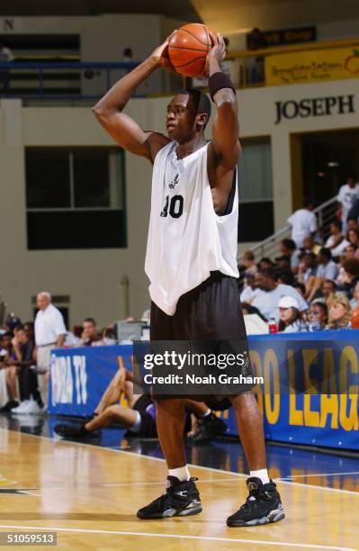 Romain Sato of the San Antonio Spurs controls the ball against the Sacramento Kings during the 2004 Long Beach Pro Summer League game at the Pyramid...