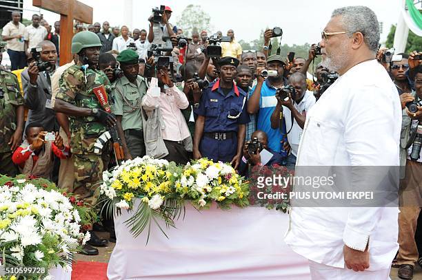 Former Ghanaian President Jerry Rawlings pays rest to Nigeria's seccessionist leader Odumegwu Ojukwu during the national inter-denominational funeral...