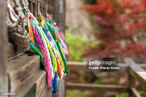 Thousand colourful, mini Origami paper cranes hanging outside a temple in Yamadera - To make wishes come true.