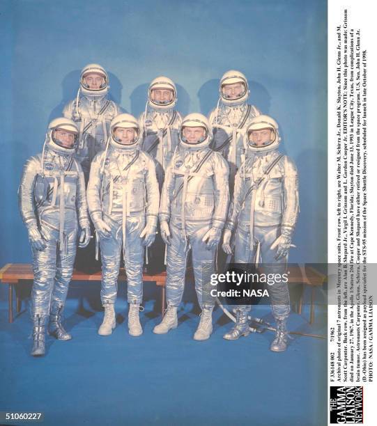 Archival Photo Of Original 7 Astronauts In Mercury Space Suits. Front Row, Left To Right, Are Walter M. Schirra Jr., Donald K. Slayton, John H. Glenn...