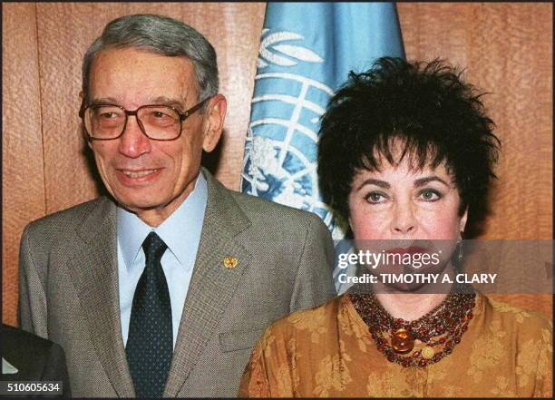 Actress Elizabeth Taylor meets with Boutros-Boutros Ghali before giving a speech in the United Nations General Assembly Hall 02 December on behalf of...