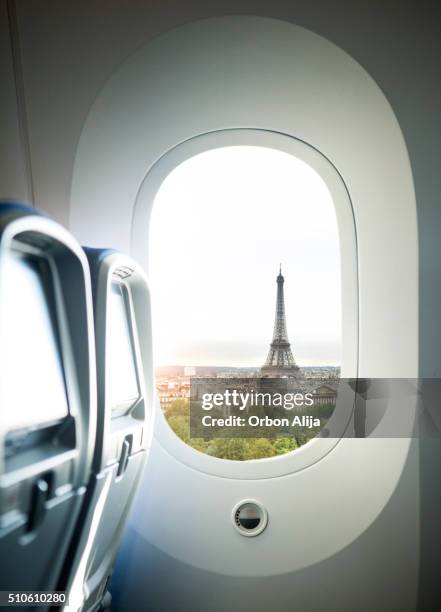 paris flight - plane windows stock pictures, royalty-free photos & images