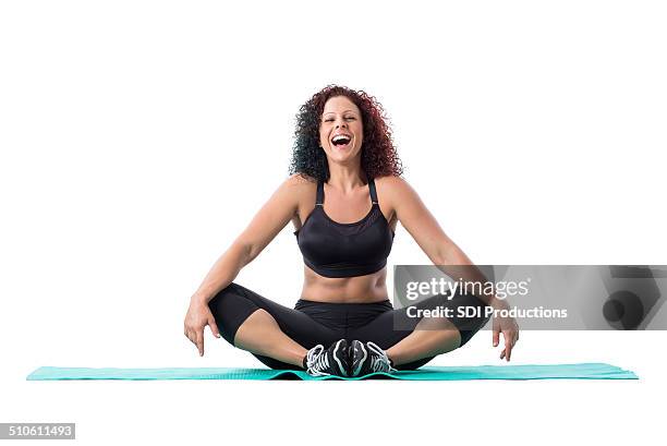 athletic fitness instructor laughing during yoga or pilates workout - trainer cutout stockfoto's en -beelden