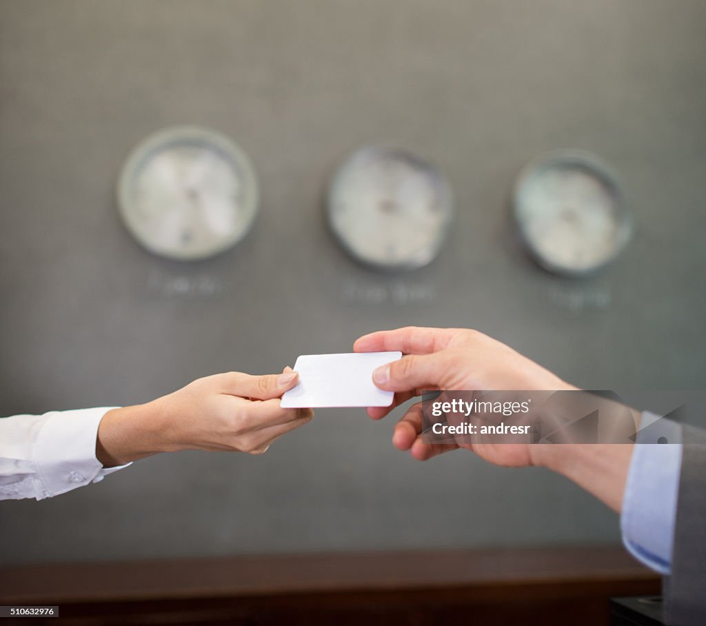 Successful people handling a business card