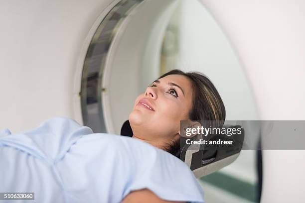 patient getting a cat scan at the hospital - pet scan stock pictures, royalty-free photos & images