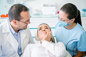 Woman with a tooth pain at the dentist