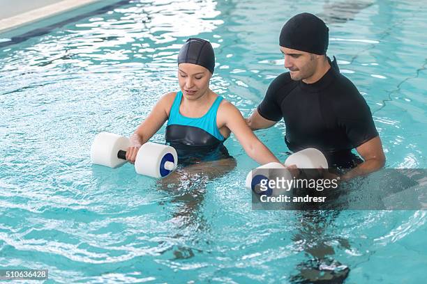 woman in physical therapy in the water - aquatic therapy stockfoto's en -beelden