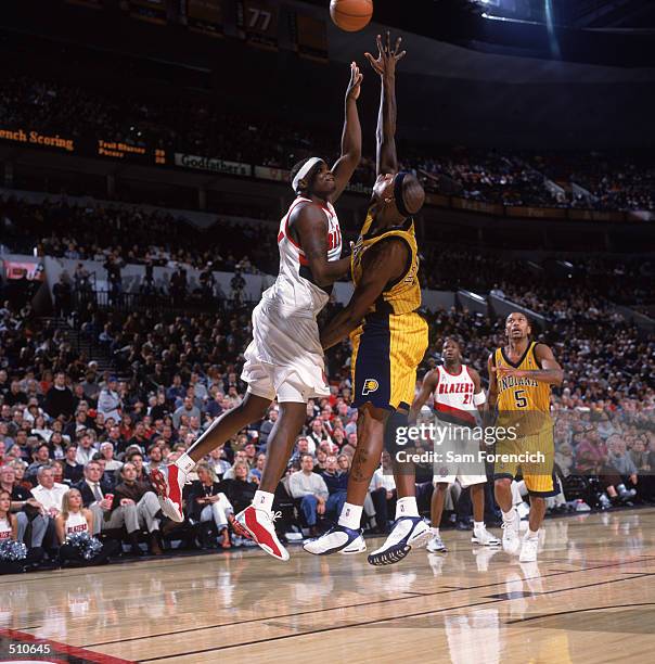 Forward Zach Randolph of the Portland Trail Blazers shoots over forward Al Harrington of the Indiana Pacers during the NBA game at the Rose Garden in...