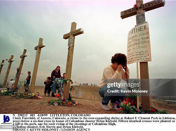 Littleton, Colorado Cindy Fairchild, Of Aurora, Colorado, A Visitor To The Ever-Expanding Shrine At Robert F. Clement Park In Littleton, Prays Below...