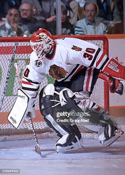 Ed Belfour of the Chicago Black Hawk stops a shot against the Toronto Maple Leafs during game action on February 29, 1992 at Maple Leaf Gardens in...