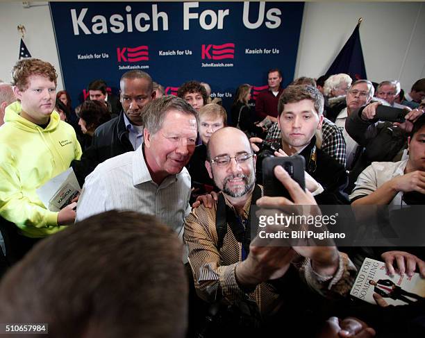 Ohio Governor and Republican Presidential Candidate John Kasich poses for a photo after he held a Town Hall meeting February 16, 2016 in Livonia,...