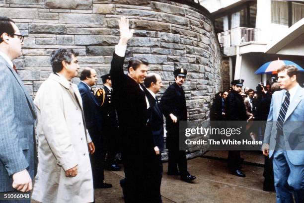 President Ronald Reagan Waves To Onlookers Moments Before An Assassination Attempt By John Hinckley Jr March 30, 1981 By The Washington Hilton In...