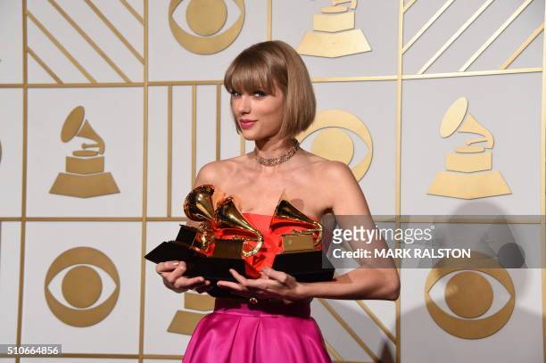Taylor Swift poses in the press room at the The 58th GRAMMY Awards at Staples Center on February 15, 2016 in Los Angeles, California. AFP PHOTO/MARK...