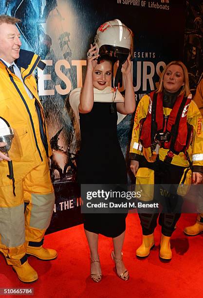 Holliday Grainger poses with members of the Royal National Lifeboat Institution at "The Finest Hours" Gala Premiere at the Ham Yard Hotel on February...